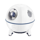 White, spherical "Spaceship Explorer" humidifier in glossy plastic with blue trim, feet & astronaut head visible in a clear dome. Features subtle grey buttons. Graphic design.