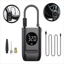 Sleek dark grey portable digital air pump displays 32.0 PSI, with flexible hose, multiple nozzle adapters, and two USB cables. Graphic insets show it inflating bike and car tires. Graphic design.