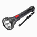 Black rechargeable flashlight made of plastic, featuring a prominent silver reflector, a red sliding power switch, and a black fabric wrist strap. Its body has a textured, ribbed grip.