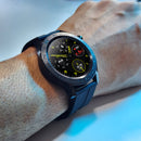 SmartWatch F22U on wrist. Dark gray metal case, black rubber strap. Round digital screen shows time, heart rate (076), steps. Bezel engraved 'SMART WATCH'. Real photo of an elegant, modern F22U smartwatch.