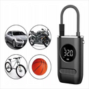 Dark gray portable air pump with a digital display showing 32.0 PSI and U-shaped hose. Graphic illustrates its use for cars, motorcycles, bikes, and balls, highlighting versatility. A clean graphic design.