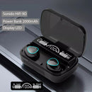 Black M10 Bluetooth earbuds in an open case with glowing blue accents. The LED display shows "100%", "Be Loud", "Be Proud", and battery levels. Features translucent lid, 2000mAh Power Bank, and HiFi 9D audio. Product image.