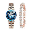 Rose gold-tone women's watch with a faceted blue 'diamond-cut' crystal face, displaying 'Meibom' text. Paired with a matching rose gold-tone link bracelet adorned with sparkling heart-shaped clear stones. Real product photo.