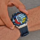 ZD5 smartwatch on wrist: silver case, blue bezel & silicone strap. Digital screen shows 03:43 on a colorful Mondrian-style face with compass markings. Real photo.