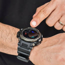 User's hand tapping a rugged black Smartwatch LC16 on their wrist. It has a gunmetal bezel, black rubber strap, and a round screen showing "Activity" with colored arrow icons. 'SMART WATCH' text and 'LIGHT' button are visible. Real photo.