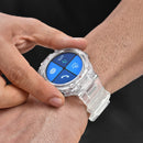 Real image. Hand interacts with a rugged, transparent Reloj DT5 smartwatch on wrist. Clear plastic case & strap. Round blue screen shows 40% battery, Alipay, call, message icons. Bezel: GPS/Sport.