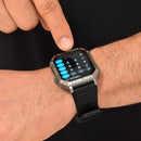 Rugged G106 smartwatch with silver frame, black rubber strap, and orange details on a person's wrist. A finger taps its screen displaying a calculator. Buttons labeled POWER, SPORT, RESET, WATER.