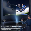 Black Magcubic HY320 projector displaying a split-screen football match on a wall, labeled '5G wifi' and 'Wi-Fi6'. A man watches its projection, highlighting dual-band WIFI6 connectivity. Graphic.