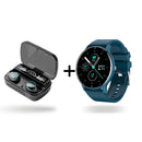 Black wireless earbuds in an open charging case showing "100%," "Be Loud," "Be Proud" text. Beside it, a dark blue round smartwatch with a black screen displaying date, temp, heart rate. A plus sign separates them on a white background. Modern tech product shot.