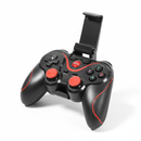 Black wireless gamepad with red accents, textured grips, dual joysticks, D-pad, HOME, ABXY buttons, and an extended retractable phone holder. Real product photo on a white background.