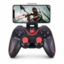 Black and red Control Gamepad X3 with a smartphone displaying a futuristic archer game mounted via a top clip. Features textured grips, dual joysticks, D-pad, ABXY buttons, HOME, SELECT, START. Wireless controller for Android/iPhone/PC. Real product photo.