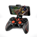 Black wireless X3 gamepad with red accents & buttons (joysticks, D-pad, A/B/X/Y, HOME), holding a smartphone displaying a game. Ideal for mobile/PC gaming. Real product on white.