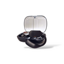 Black OWS-80 wireless open-ear headphones with transparent design elements visible, resting in their open charging case with a clear lid. Features matte black finish, speaker grill, and charging contacts. Real photo.