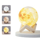 Moon-shaped aroma diffuser lamp "Luna WO-1" with realistic crater texture, glowing yellow on a light wood stand, emitting mist. Smaller images show white and warm white light modes. Graphic design.