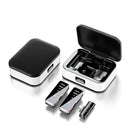 Wireless microphone kit. Two white charging cases with black textured lids & digital "100" displays. Two sleek black/rose gold lavalier mics & a small receiver on a white background. Studio shot.