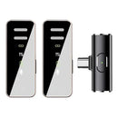 S18Pro wireless microphone set: Two compact, sleek transmitters with dark glossy tops showing signal, link, battery, and mic icons, light grey bottoms, and rose gold metallic trim. Includes one black cylindrical USB-C receiver with a green LED indicator. Studio photo.