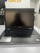 Used DELL Inspiron 3493 laptop, open on a white table. Features a black chassis, dark screen, black keyboard, and a textured carbon fiber-like palm rest. DELL logo visible on the screen bezel and on a sticker with Intel Core i3 branding. Real image.