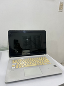 Used SONY VAIO SVF14325CLW laptop, open. Silver casing, yellowed-gold keys, black screen with "SONY" branding, "VAIO" logo on palm rest. Real photo, visible wear on white surface.